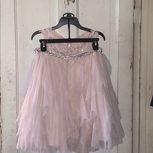 Pink cropped top and shirt with silver sparkles.